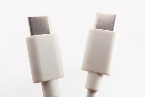 Macro close-up of white Micro USB and USB Type-C cable connectors side by side Stock Photos