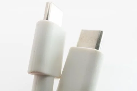 Macro close-up of white Micro USB and USB Type-C cable connectors side by side Stock Photos