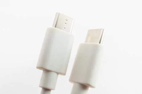 Macro close-up of white Micro USB and USB Type-C cable connectors side by side Stock Photos
