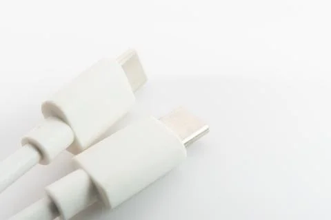 Macro close-up of white Micro USB and USB Type-C cable connectors side by sid Stock Photos