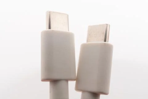 Macro close-up of white Micro USB and USB Type-C cable connectors side by side Stock Photos