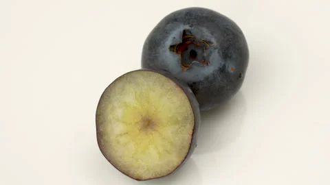 Macro Close-Up of Whole and Cut Half Blueberry Cross-Section 4K Stock Footage 320658622