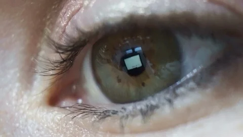 Macro close up, womans eye reflecting internet search scrolling on screen Stock Footage 119946597