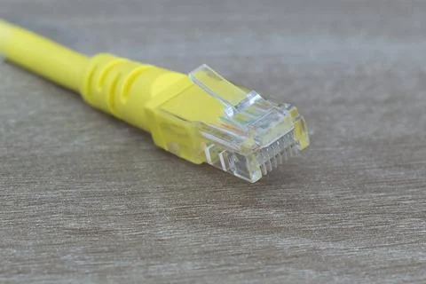 Macro close up of yellow ethernet cable connector Stock Photos