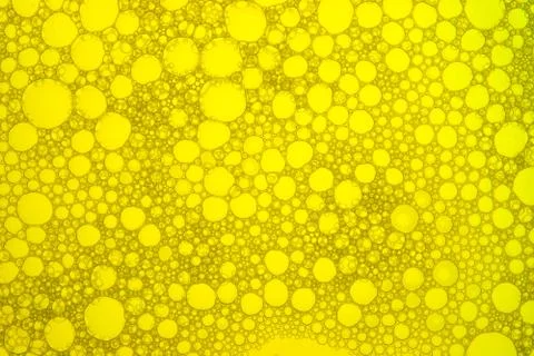 Macro close up of yellow soap bubbles. Stock Photos