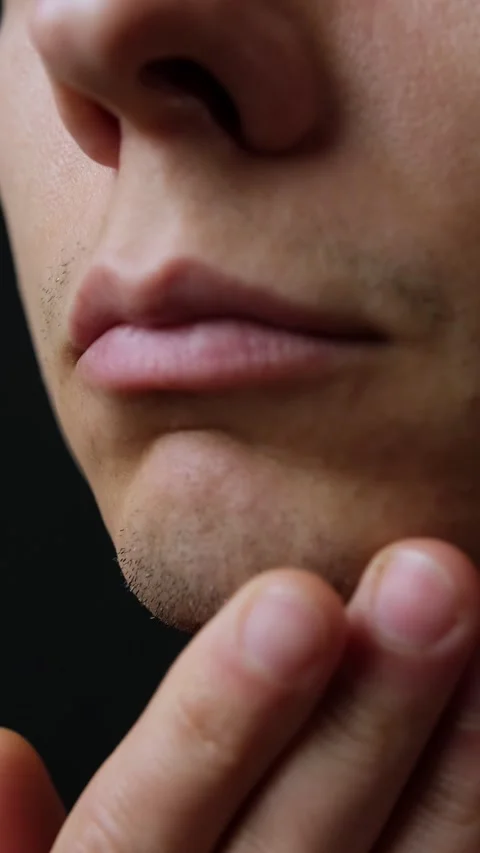 Macro close-up of young man sparse facial stubble, concept of imperfection Stock Footage 318065396