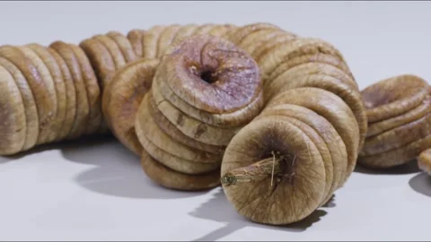 Macro close up zoom out shot of dried fig on table Stock Footage 280337204