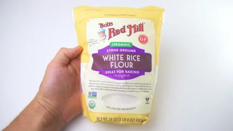 Macro closeup of Bob's red mill organic white rice flour starch package Stock Footage 194548072