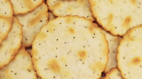 Macro closeup of crackers rotating, with a shallow depth of field Stock Footage 140583200