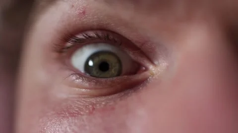Macro closeup of an eye preparing for sudden opening Video stock 329586175