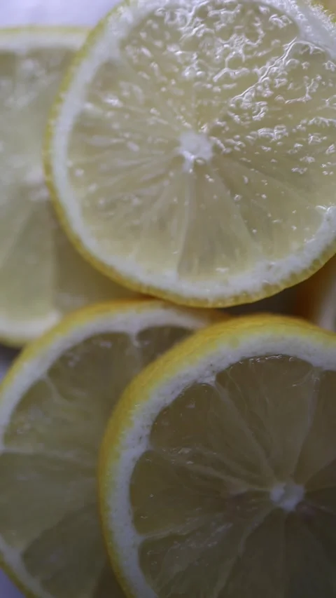 Macro closeup of fresh juicy lemon slices showing detailed citrus texture Видео 342610659