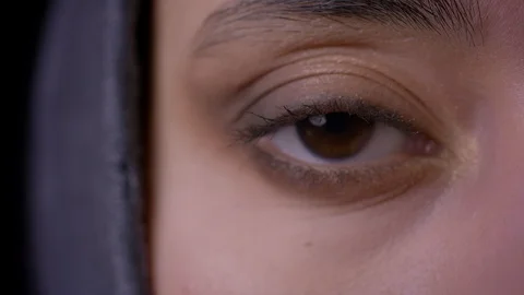 Macro closeup half-face shoot of young attractive muslim female face in hijab Stock Footage 105854515