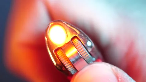 Macro Closeup Hand Holding a Lighter and Lighting it up Showing The Flame Stock Footage 148240521