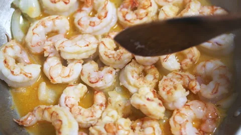 Macro closeup of large king jumbo Argentinian shrimp on frying pan Stock Footage 164567429