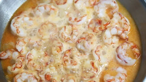 Macro closeup of large king jumbo Argentinian shrimp on frying pan Stock-Footage 164600232