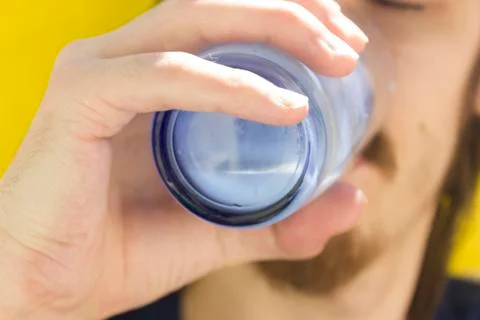 Macro closeup of lower half of man's face with thick white milk covering uppe Stock Photos