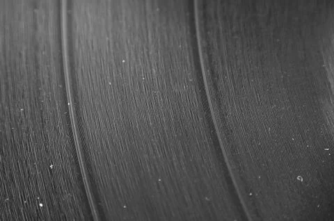 A macro closeup of an lp record with dust in the grooves Stock Photos