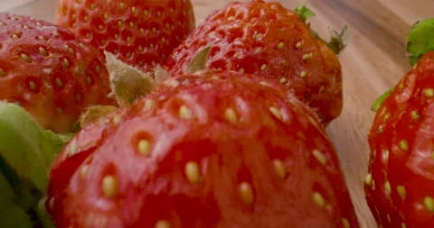 Macro closeup over fresh, ripe strawberries Stock Footage 138137745