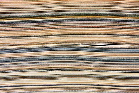Macro closeup of pages in stack magazine, cardboard or cardstock. 스톡 사진