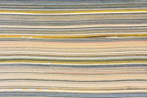 Macro closeup of pages in stack magazine, cardboard or cardstock. Fotos Stock