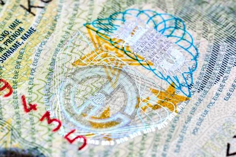 Macro closeup of Polish Schengen visa sticker in passport showing intricate h Stock Photos