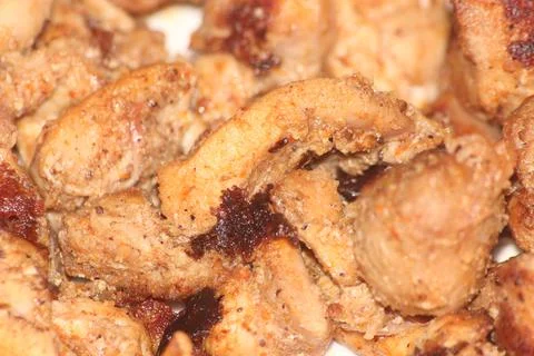 Macro closeup with selective focus on grilled chicken meat steaks. Stock Photos