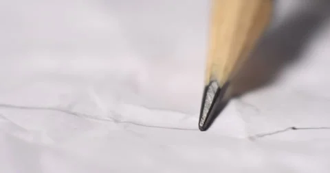 Macro Closeup of Sharp Pencil Point Resting on Crumpled White Paper Video stock 297704011