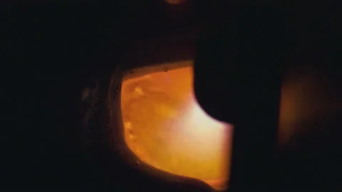 Macro closeup shoot. Goldsmith melting silver or valuable metal to liquid state Stock Footage 109096766