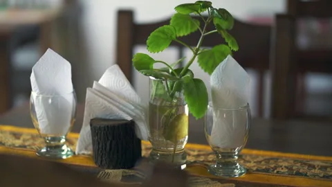 Macro closeup shot of dining table top with napkins, patterned cloth and Stock Footage 283520783