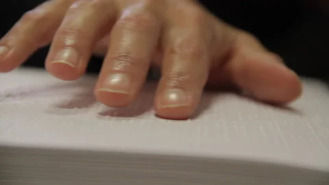 Macro closeup shot hand passing by reading braille Stock Footage 139099281