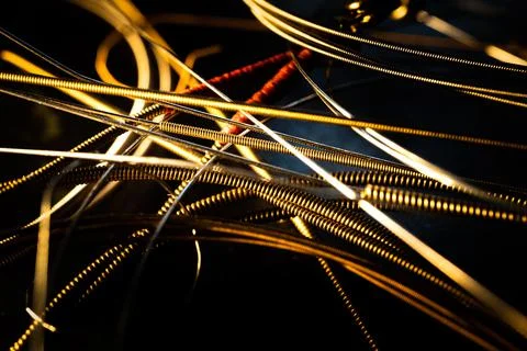 Macro Closeup of Texture on group of Bronze Acoustic Guitar Strings Stock Photos