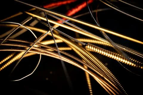 Macro Closeup of Texture on Used Bronze Acoustic Guitar Strings Foto stock