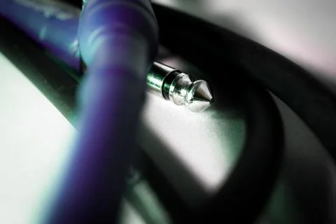 Macro Closeup of Tip of Quarter Inch Jack Connector with Purple Rubber Casing Stock Photos