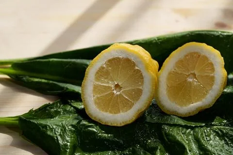 Macro closeup of wet lemon slice with glossy pulp, bright yellow rind, fresh cit Stock Photos