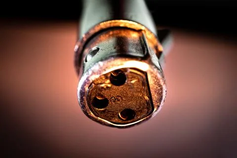 Macro Closeup of Worn Out Three Pin XLR Connector In Front of White Backgroun Stock Photos
