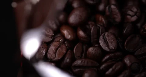 Macro coffee beans in a package in slow motion Stock Footage 130361667