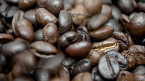 Macro of coffee beans raining slowmotion Stock Footage 93086316