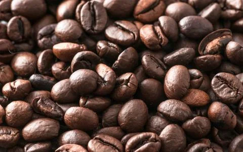 Macro coffee beans roasted Stock Photos