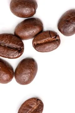 Macro of coffee beans on white background. Selective focus Stock Photos