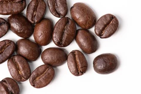 Macro of coffee beans on white background. Selective focus Stock Photos