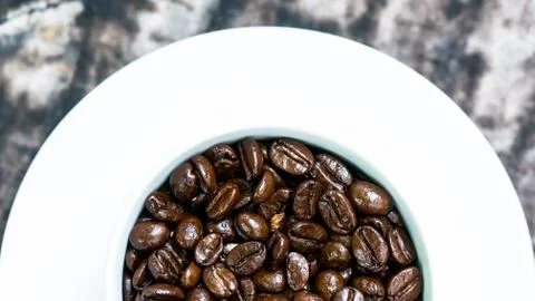 Macro of coffee seed in a cup Stock Photos