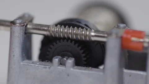 MACRO OF COGS ON A SMALL WIND UP MUSIC BOX AS IT TURNS Stock Footage 126420609