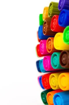 Macro of colored markers on white background Stock Photos