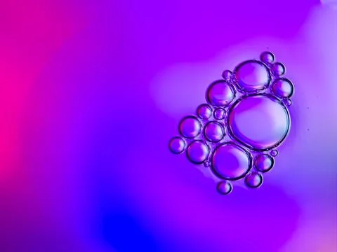 Macro colorful soap bubbles gradient abstract background blue pink Stock Photos