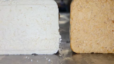 Macro Comparison of Fresh White Tofu and Smoked Tofu on Production Line. Close-u Stock Footage 332874806