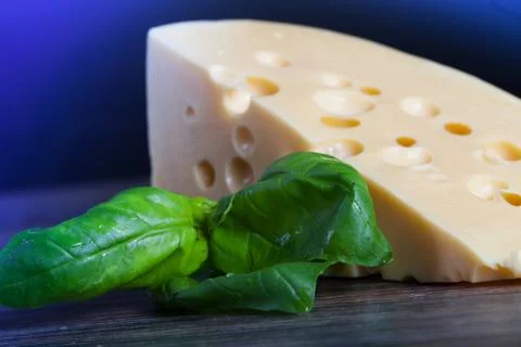 Macro composition of cooking ingredients, cheese, rosemary, basil leaves, and Stock Photos