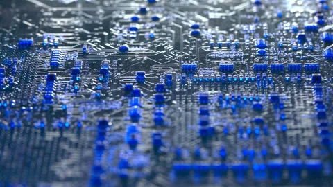 Macro of computer circuit board with blue light scanning across components Stock Footage 335030692