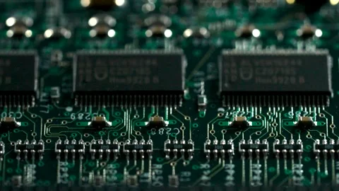 Macro of computer circuit board with light scanning across components Stock Footage 335030907