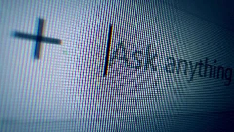 Macro of a computer screen showing a cursor and the text Ask anything. Concept Stock Photos