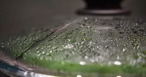Macro condensation texture on glass lid over steaming green vegetables Stock Footage 340278102